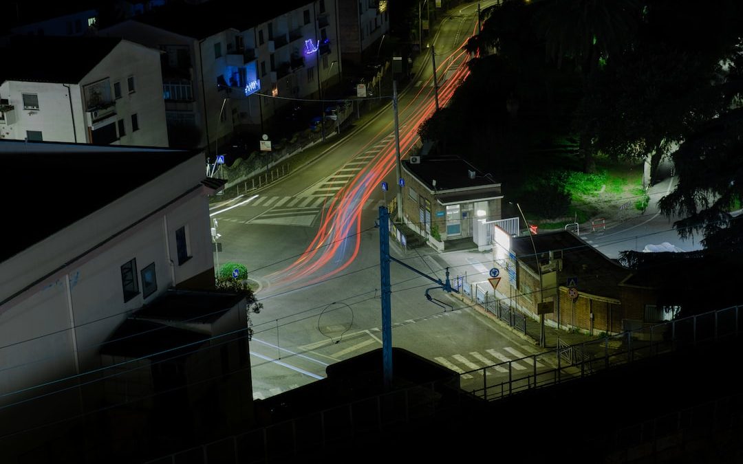 a city street at night with a long exposure