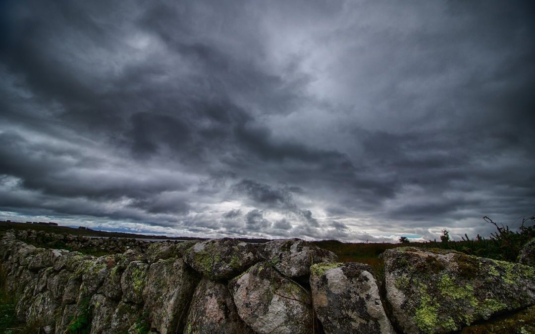 rocks under cloudy sky