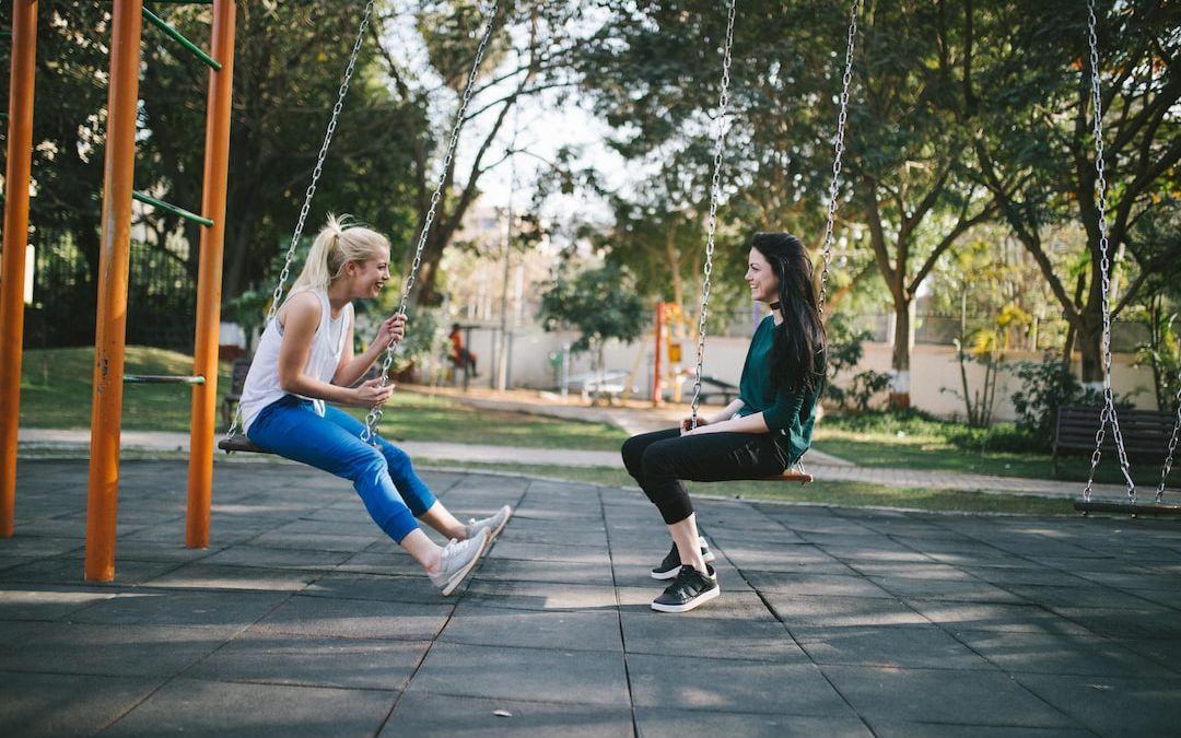 woman sitting on swing