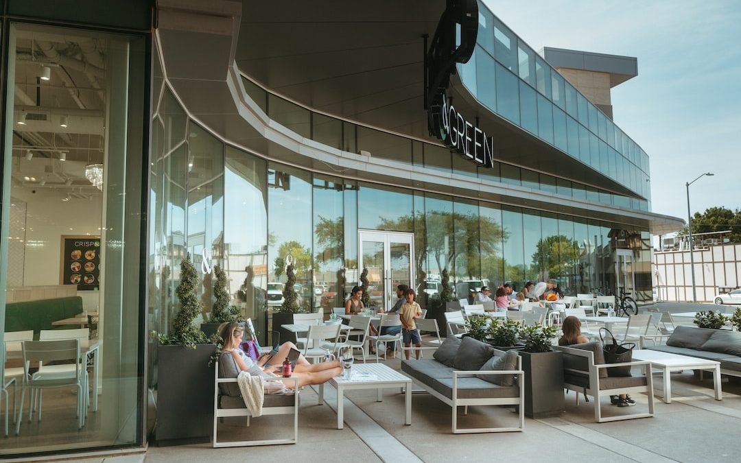 a group of people sitting outside a building