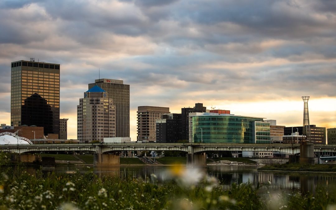 city skyline under gray cloudy sky during daytime