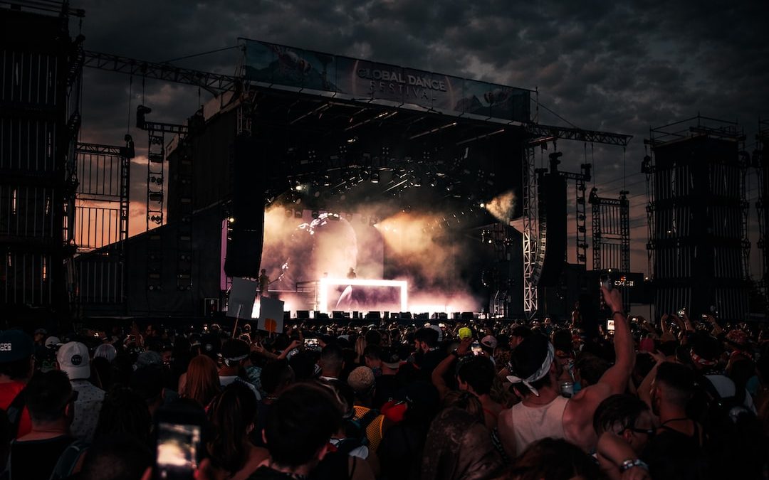 crowd of people watching concert during night time