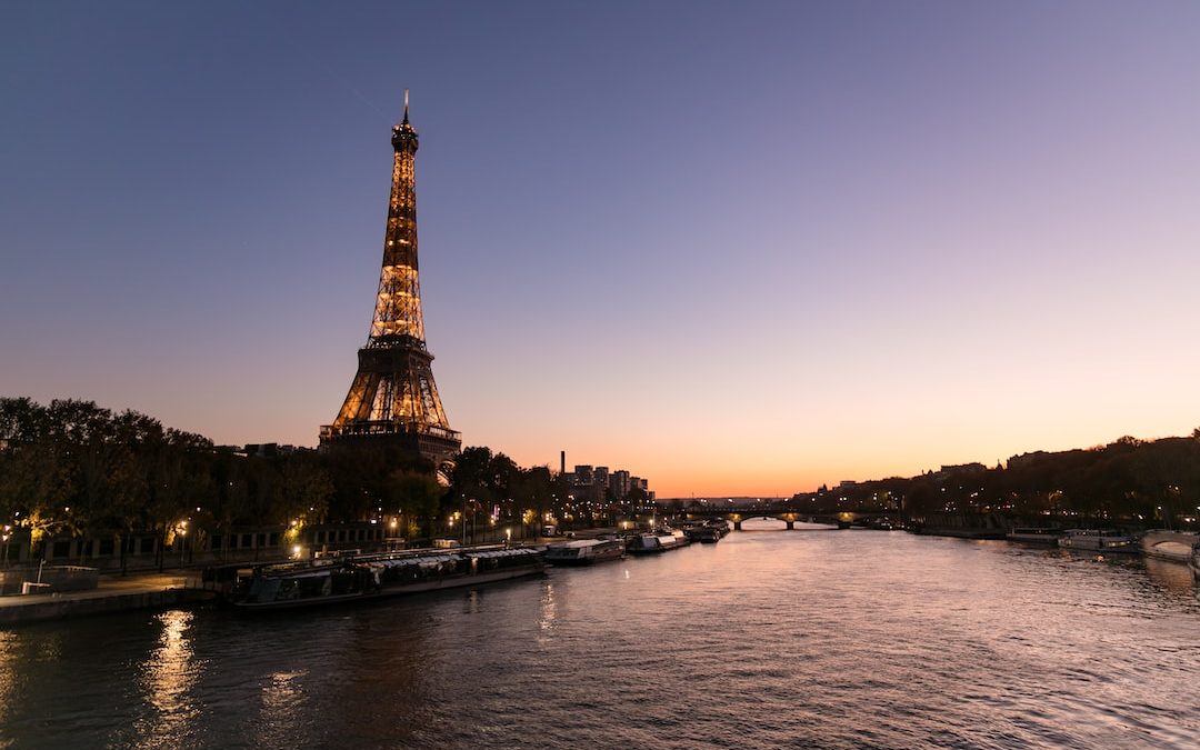 eiffel tower near body of water during daytime