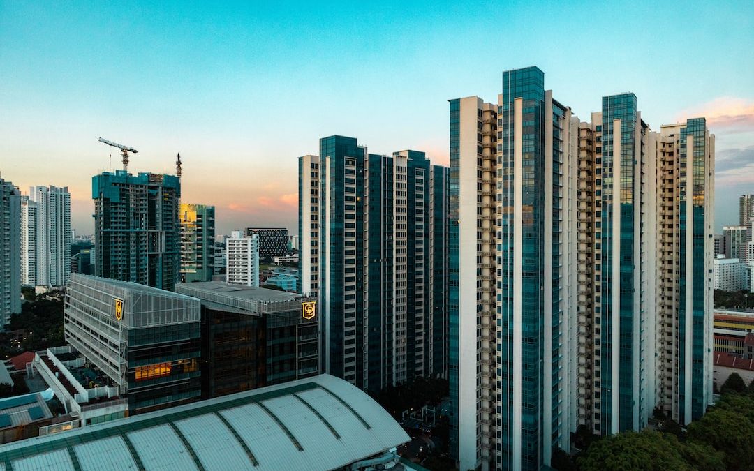 buildings beside green trees