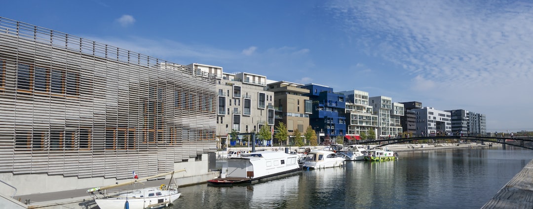 a body of water with boats and buildings along it