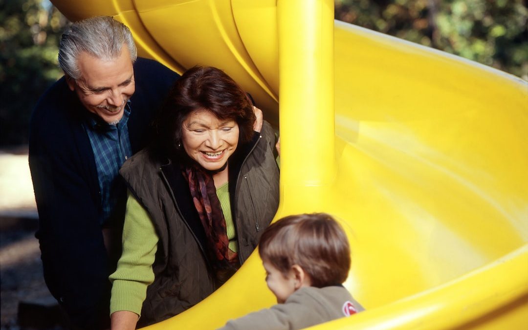 toddler sliding on yellow slide