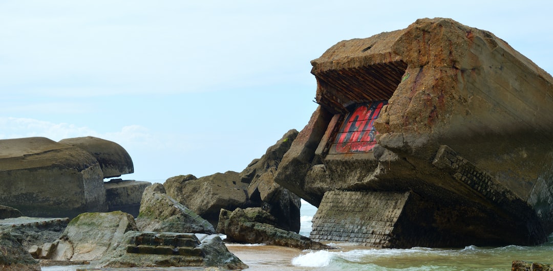 a large rock with a red window in it