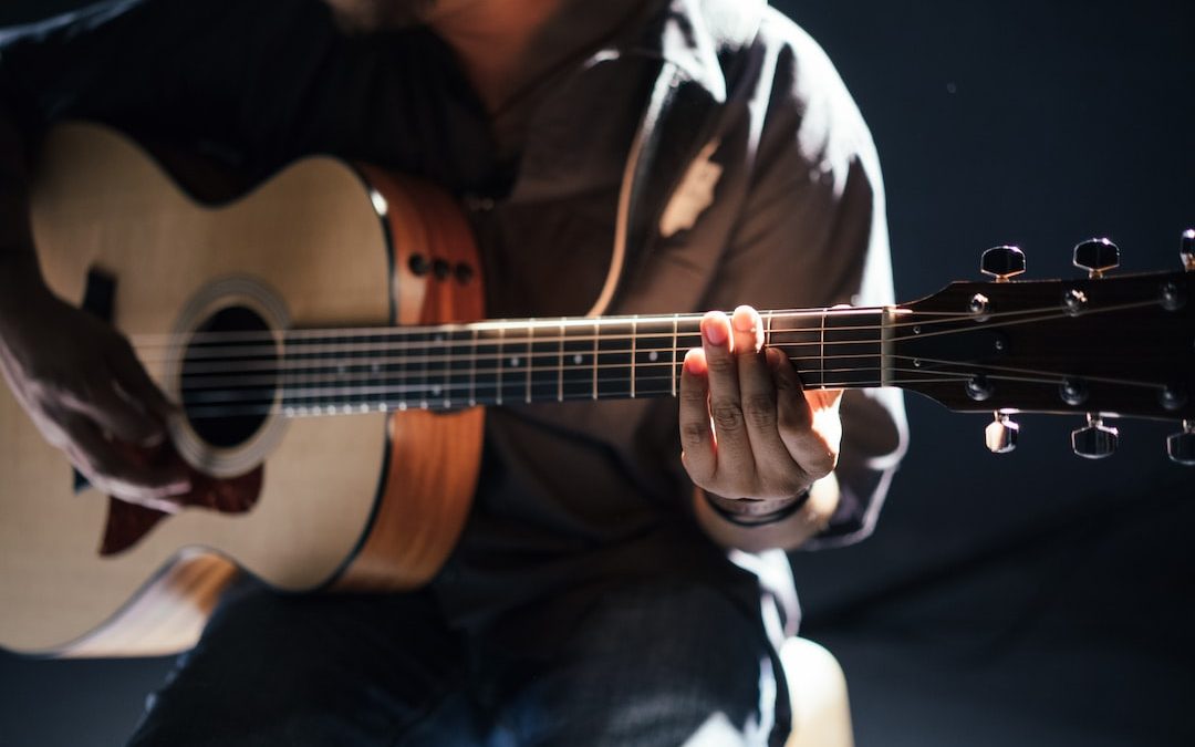 person playing guitar