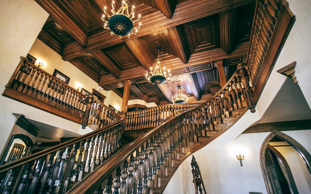 white and brown wooden house with stairs