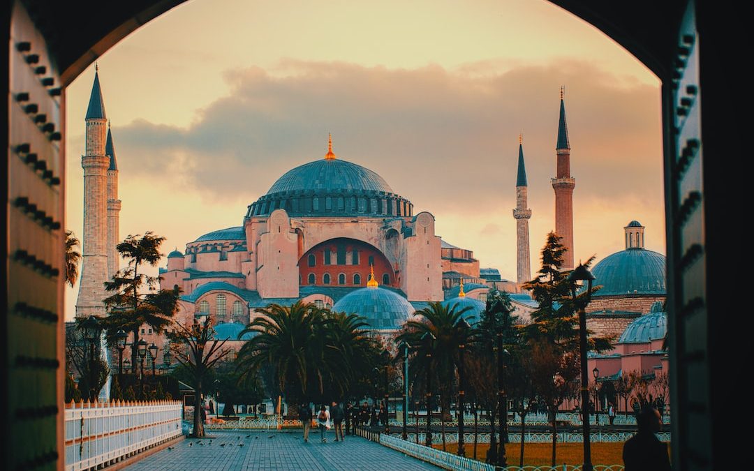 a view of a mosque through an archway