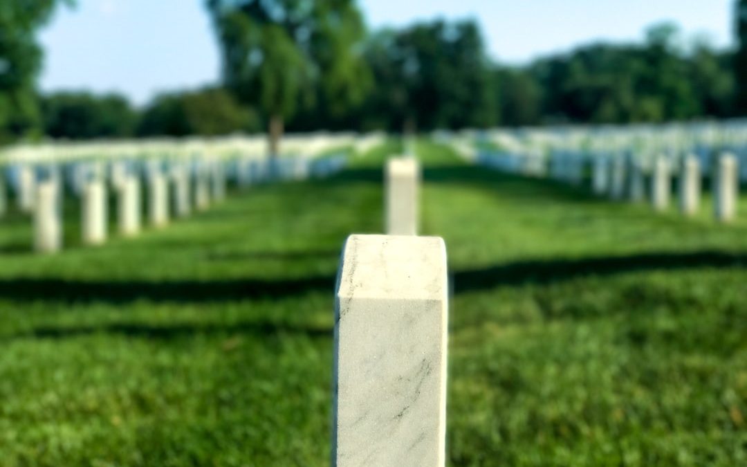 white tombstone in cemetery