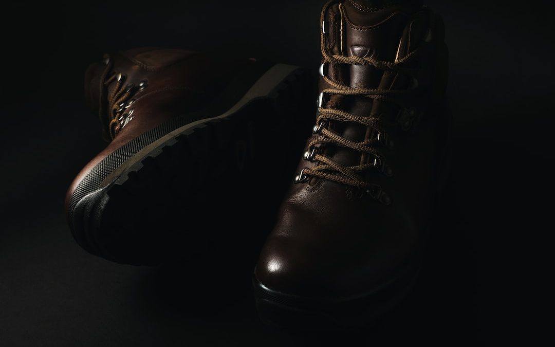 pair of brown leather lace-up combat boots