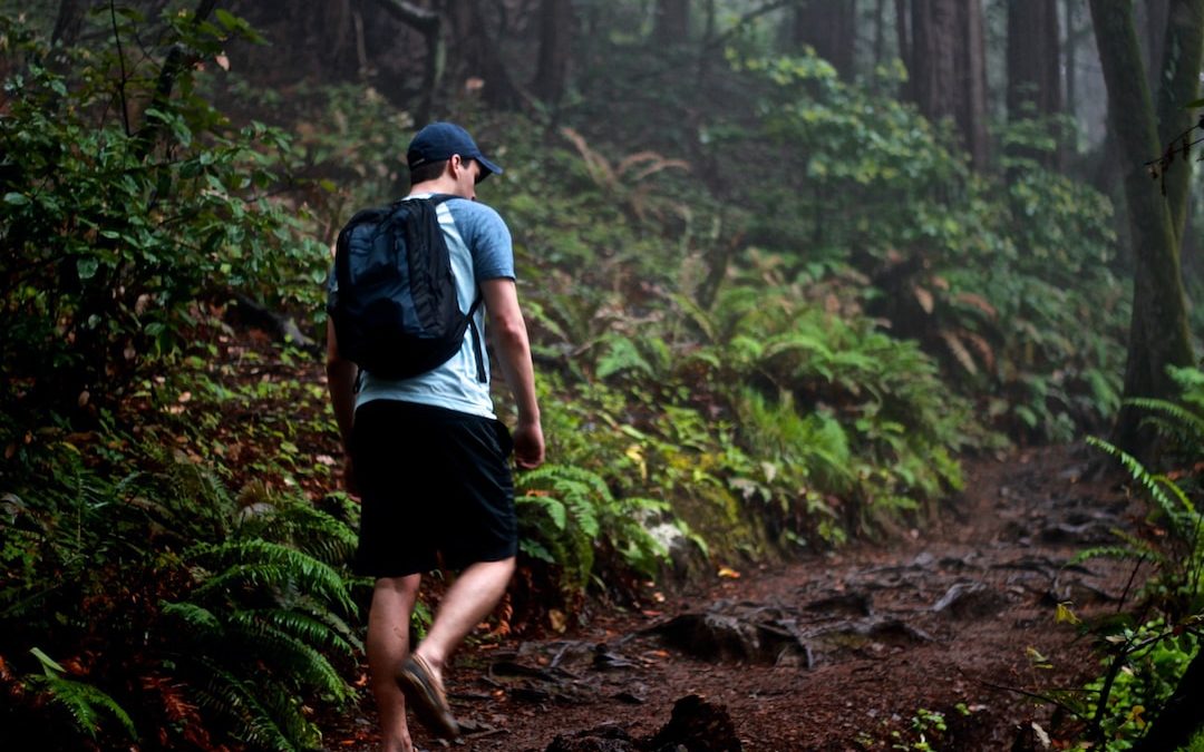 man walking on mountain