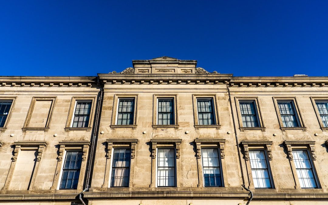 beige concrete building under blue sky during daytime