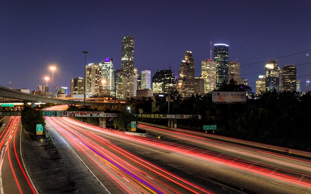 time lapse photography of vehicle traveling with a speed of light in road