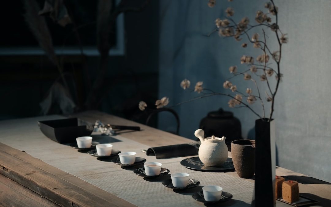 white flowers on black ceramic vase