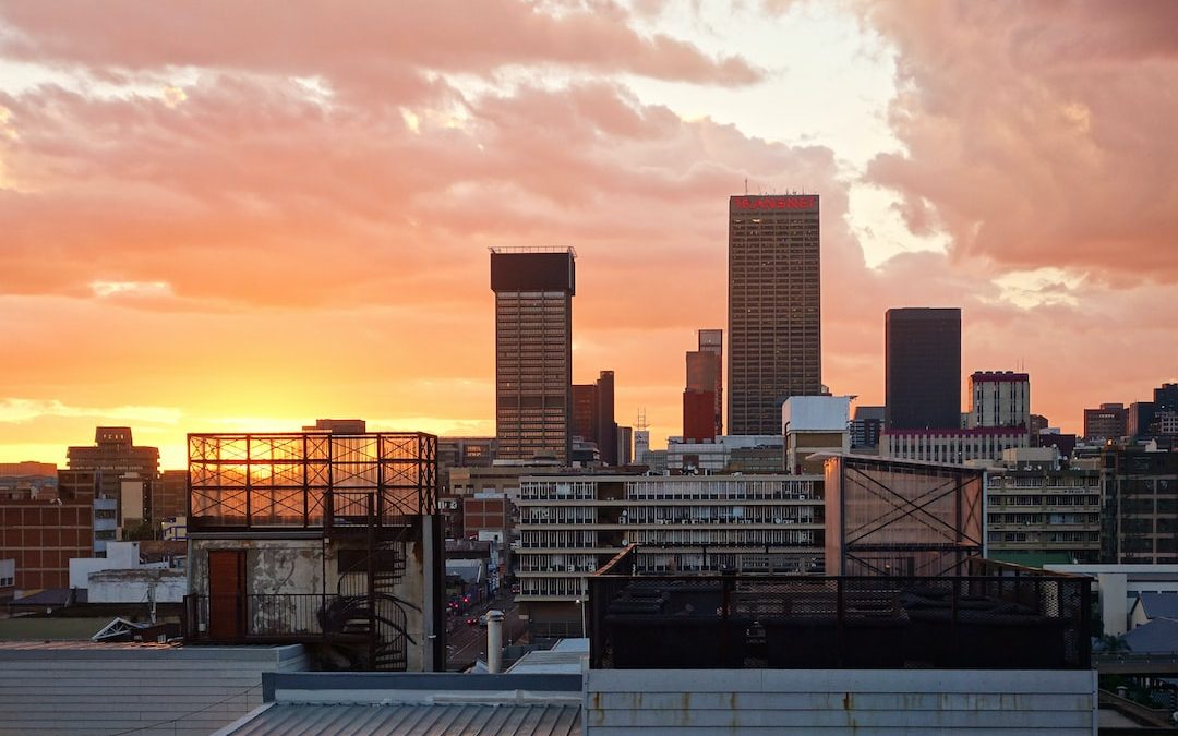 city skyline during sunset with cloudy sky