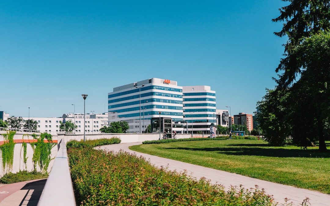 white concrete building near green grass field during daytime