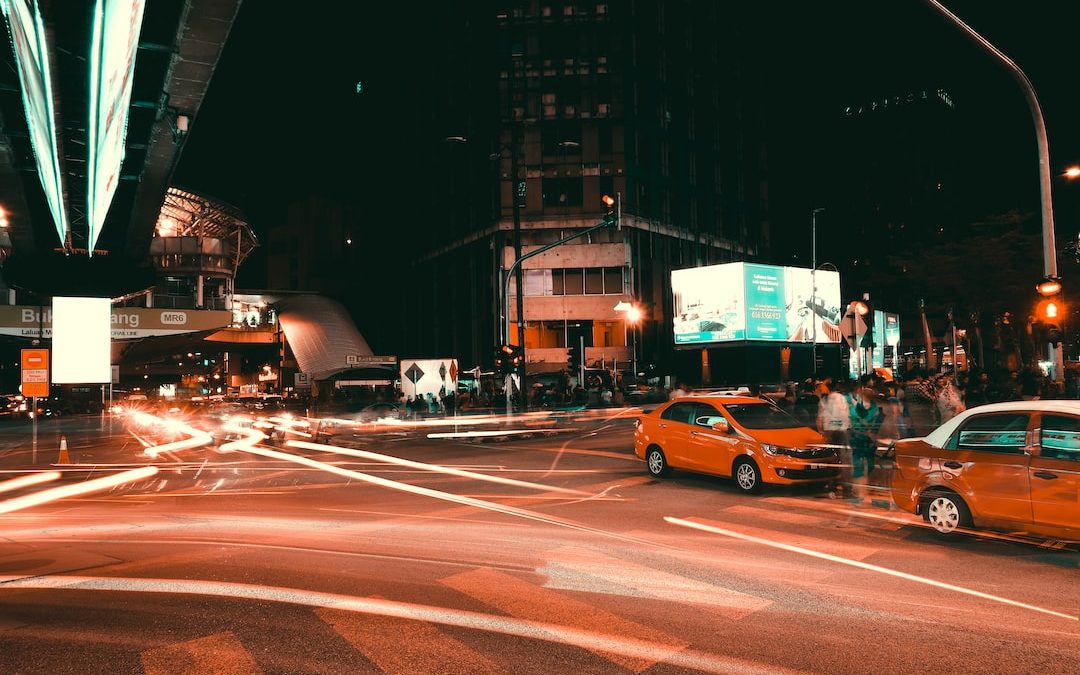 orange vehicle running on the road