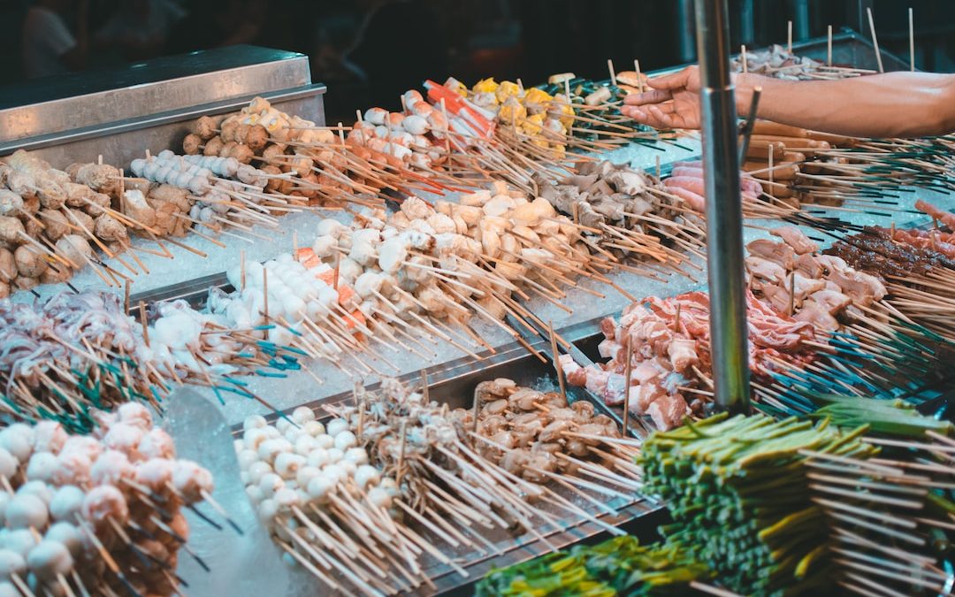 skewered meat on trays with ice packs