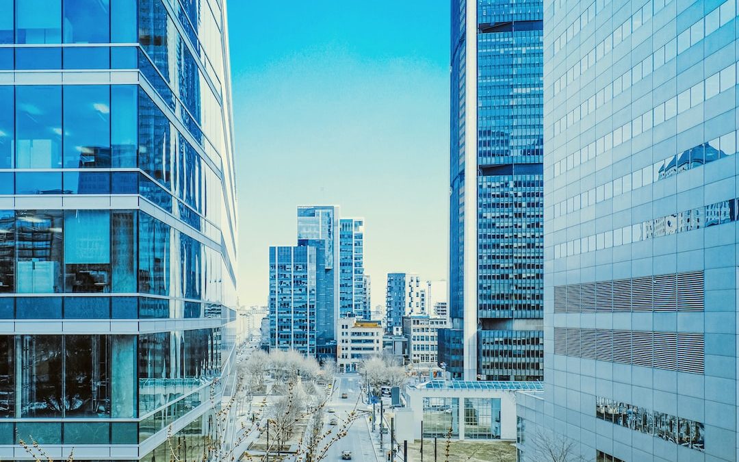 a city street lined with tall buildings next to each other