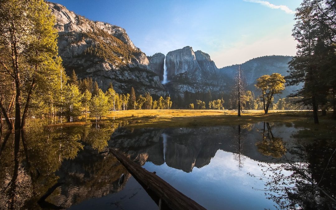 body of water near mountain range