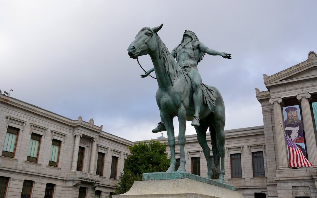 a statue of a person riding a horse