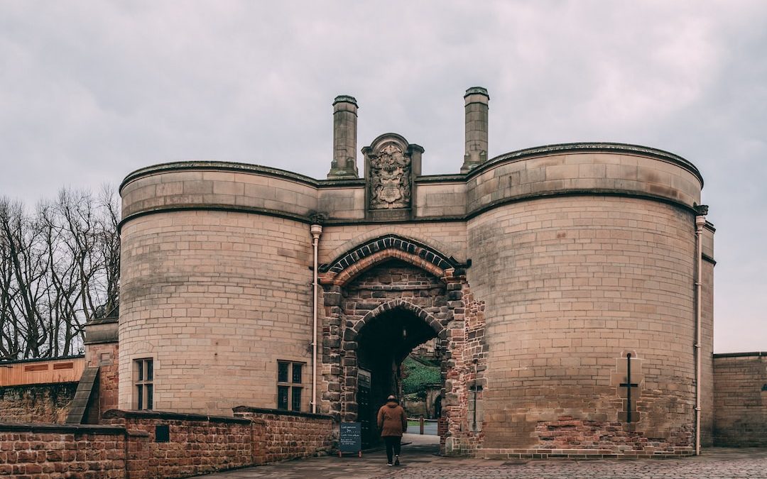 a large brick building with a clock on the top of it