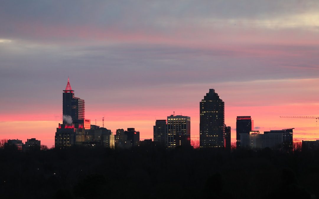 a view of a city skyline at sunset