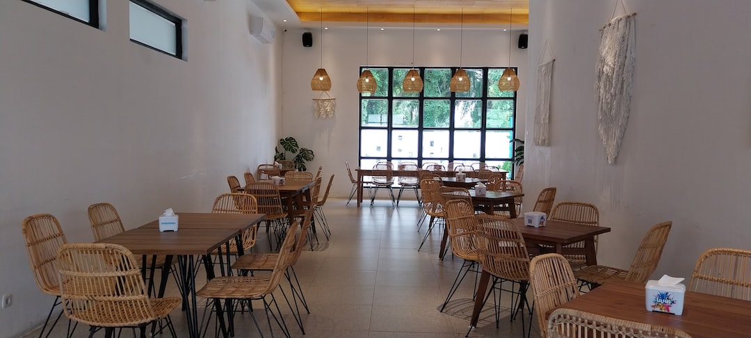 a restaurant with wicker tables and chairs