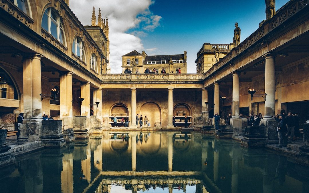 a large building with a pool in the middle of it