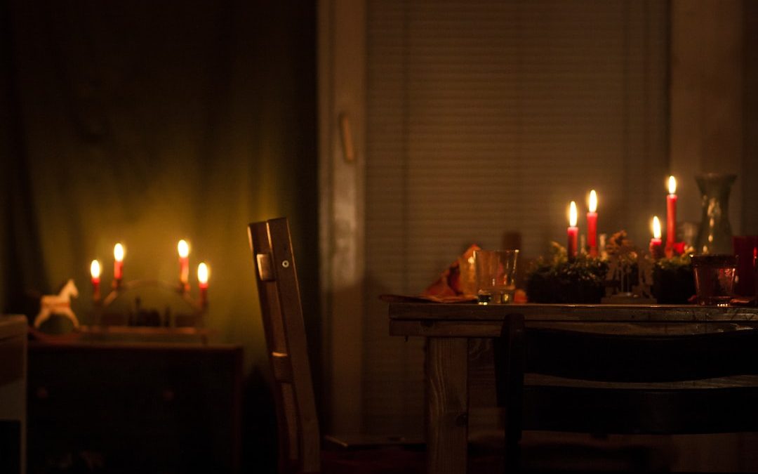 lighted candles on brown wooden table