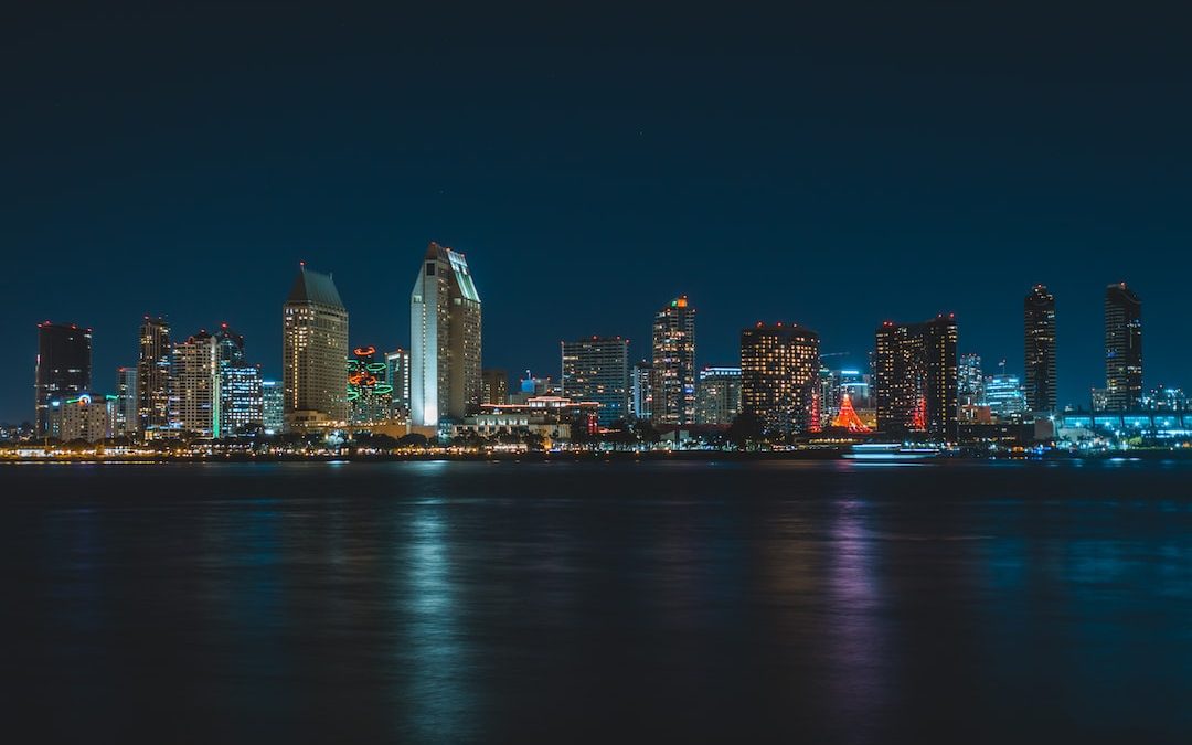 city near body of water during nighttime