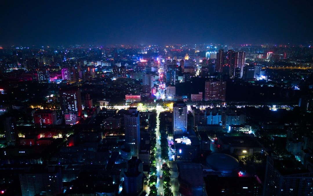 a view of a city at night from the top of a building