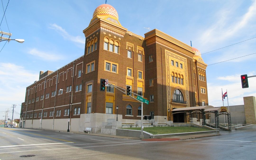 a large brick building with a yellow dome on top