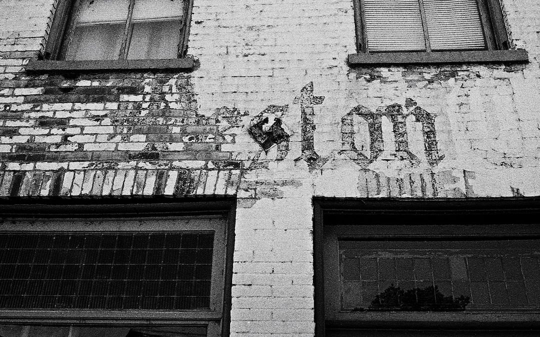 a building with windows and a sign on the side