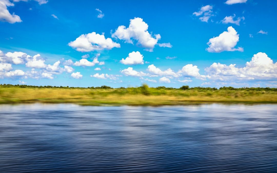 blue sky and white clouds over the lake