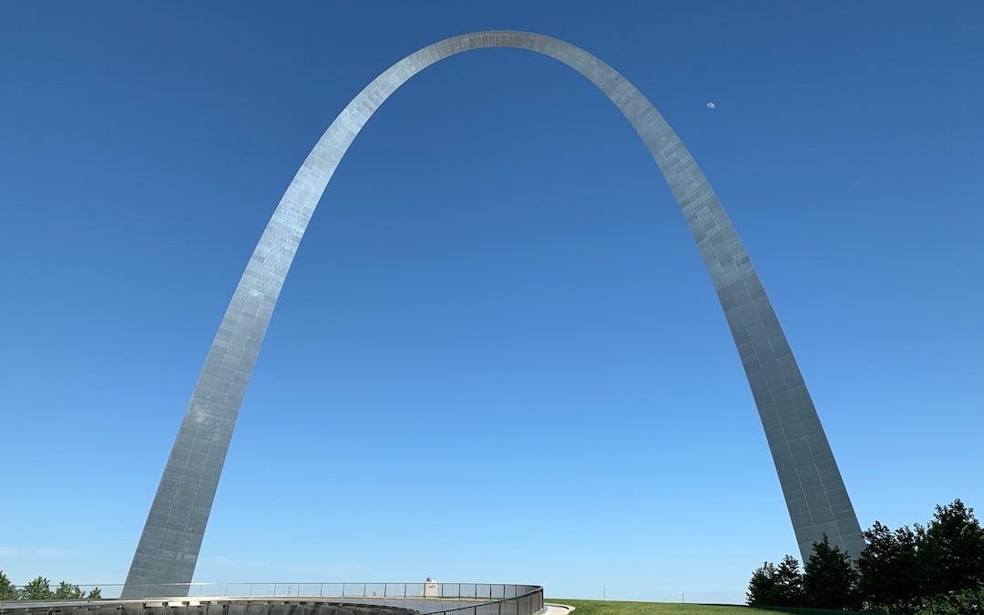 white metal arch under blue sky during daytime