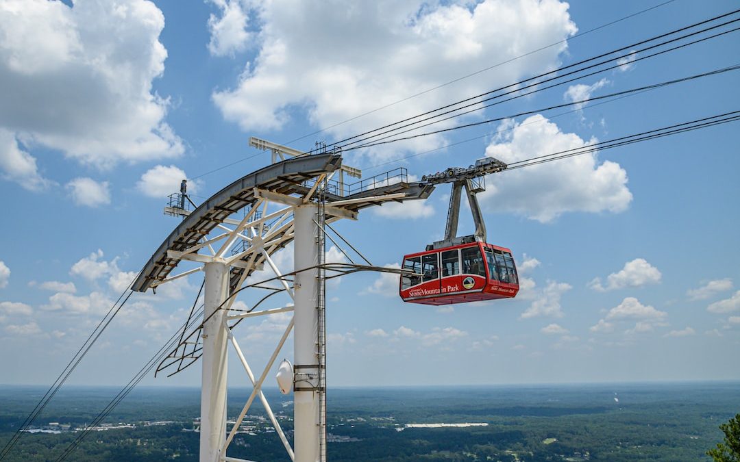 a cable car suspended over a city