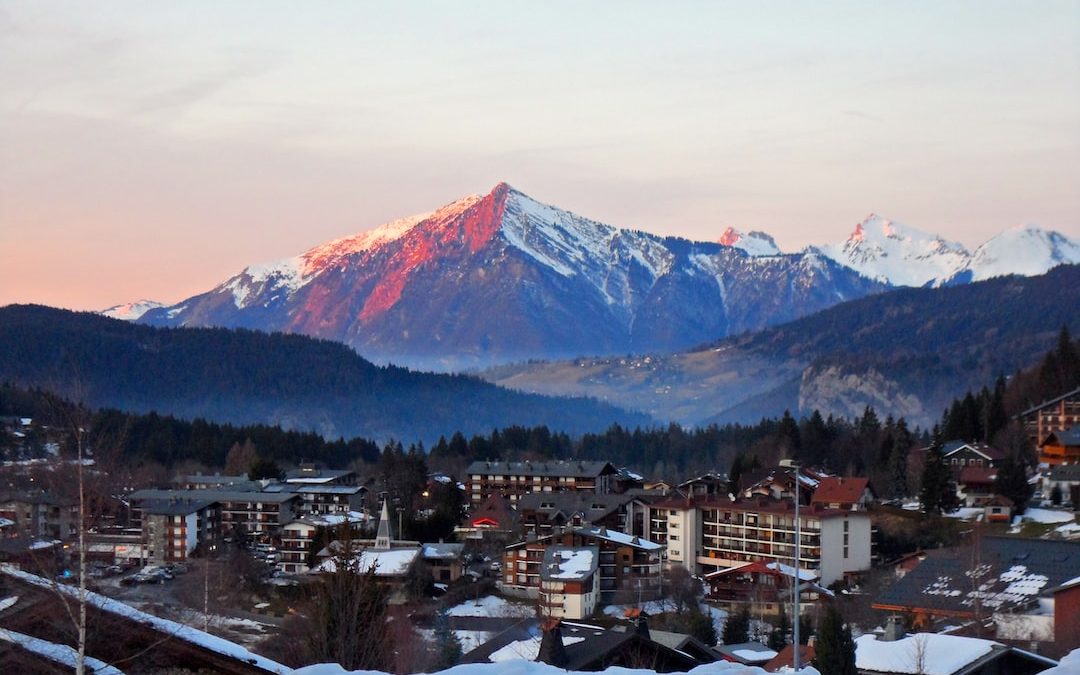 a town with snow covered mountains