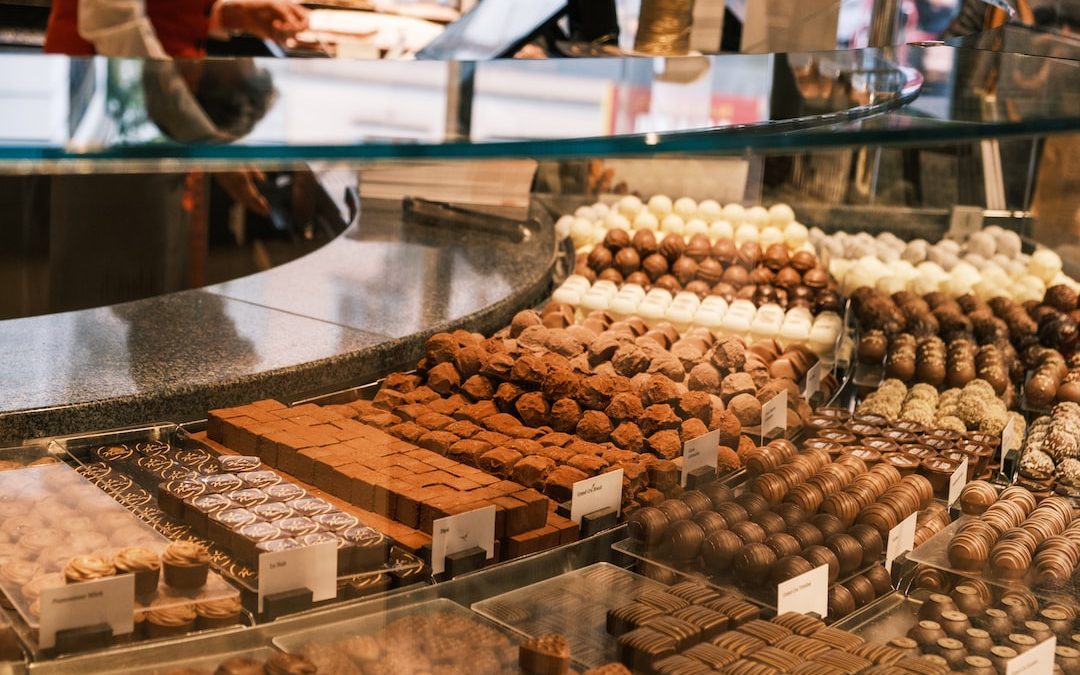 a display case filled with lots of different types of chocolates
