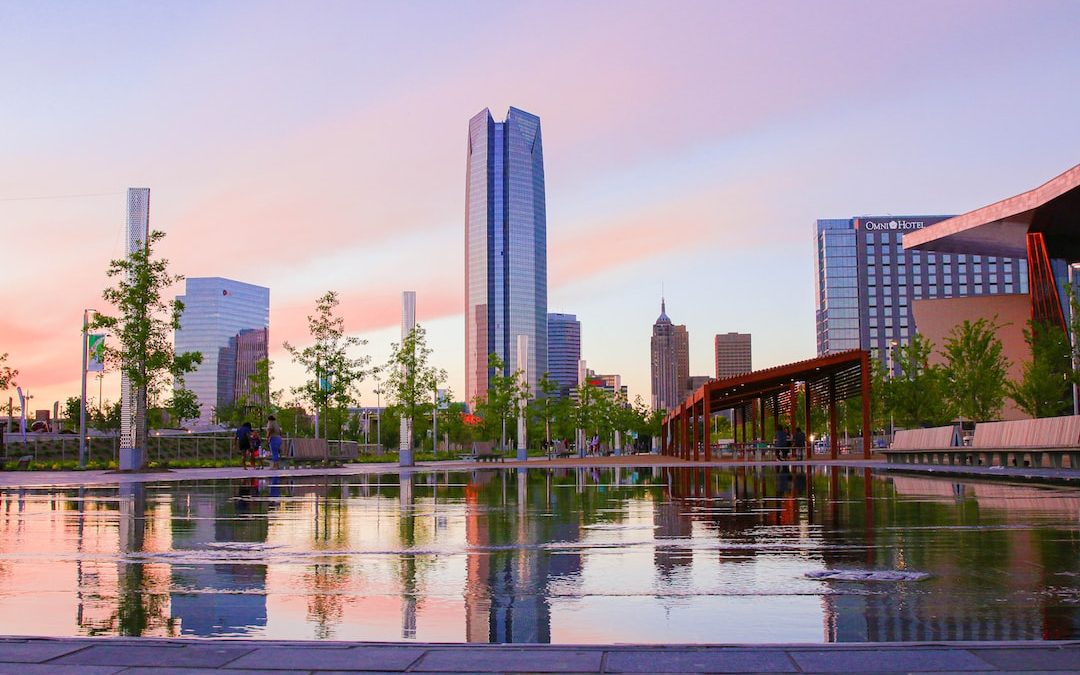 body of water near high rise buildings during daytime