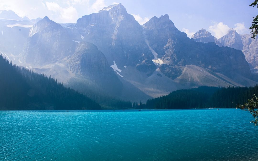 lake near mountain range during daytime