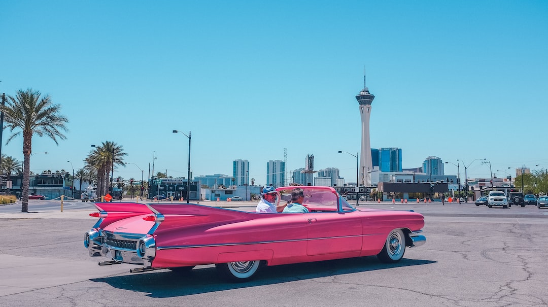 people riding pink car