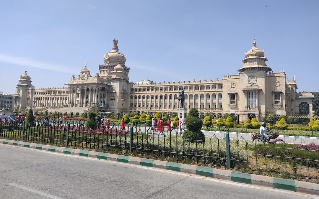 a large building with a fence in front of it