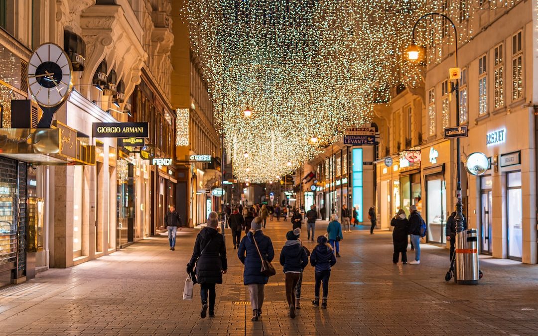 people walking on street during night time