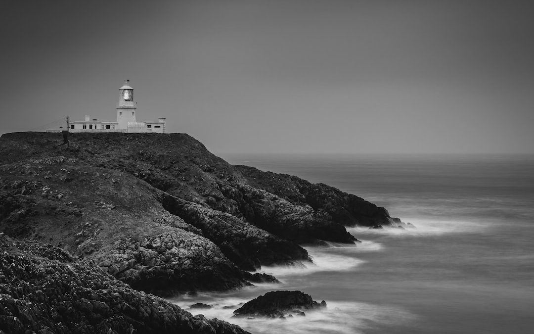 a black and white photo of a lighthouse