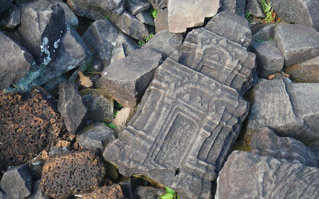 a close up of some rocks with writing on them