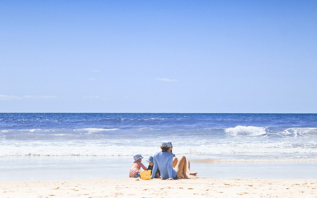 unknown persons enjoying on beach