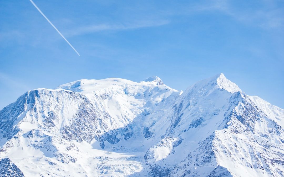 snow covered mountains under blue sky during daytime